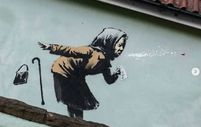 Sneezing woman Banksy mural