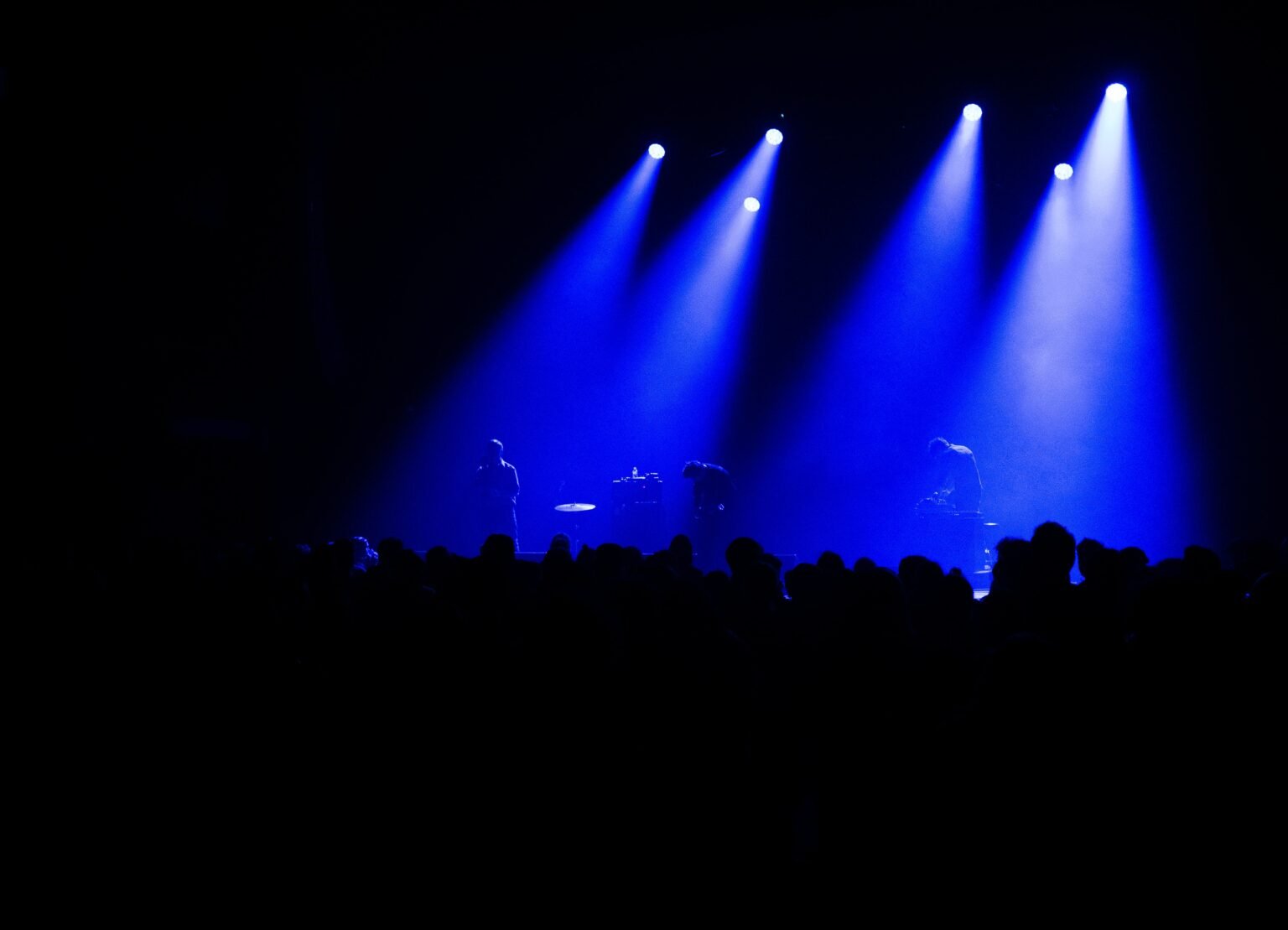 Blue lights illuminating the dancefloor.