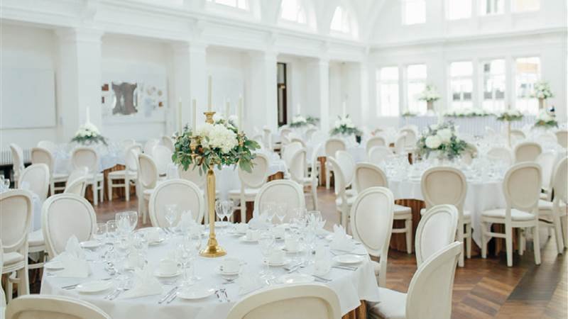 White furniture decorated for a wedding.